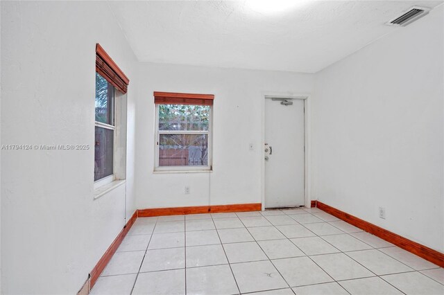 4241 W 1st Ave, Hialeah, FL 33012 - unfurnished room featuring baseboards and visible vents