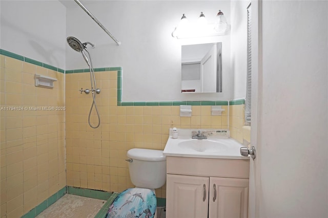 4241 W 1st Ave, Hialeah, FL 33012 - bathroom with vanity, toilet, tile walls, a wainscoted wall, and a tile shower