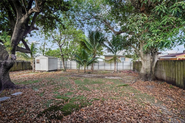 4241 W 1st Ave, Hialeah, FL 33012 - view of yard with a fenced backyard, an outdoor structure, and a shed