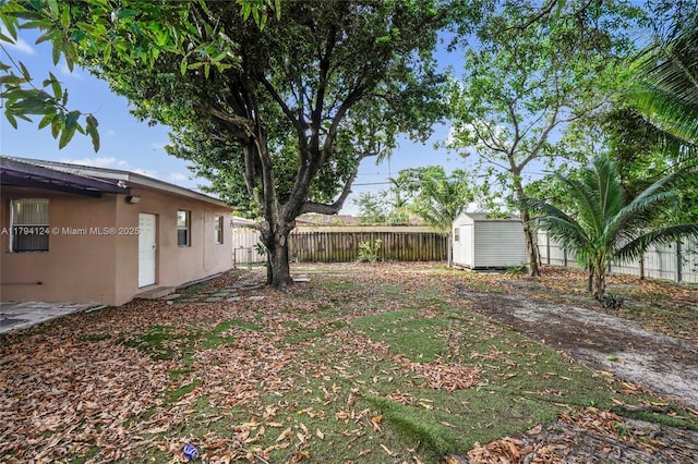 4241 W 1st Ave, Hialeah, FL 33012 - view of yard with fence, an outdoor structure, and a shed