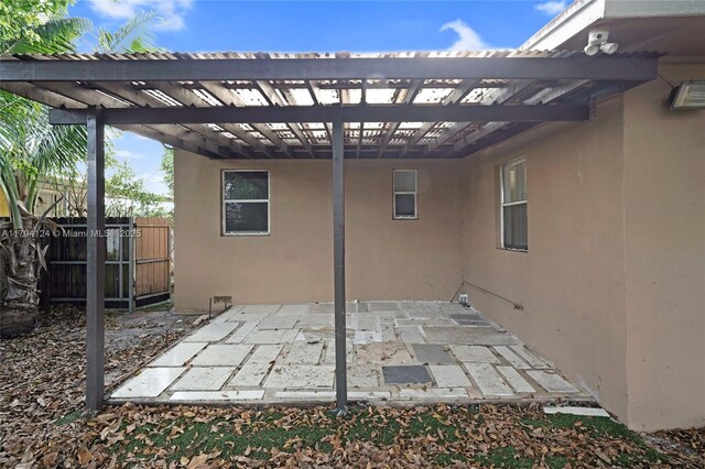 4241 W 1st Ave, Hialeah, FL 33012 - view of patio / terrace with fence and a carport