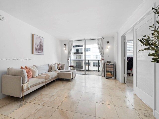 6039 Collins Ave Unit 1015, Miami Beach, FL 33140 - living room featuring expansive windows and a wealth of natural light