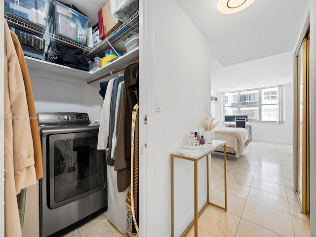 6039 Collins Ave Unit 1015, Miami Beach, FL 33140 - washroom with washer / clothes dryer, laundry area, and baseboards