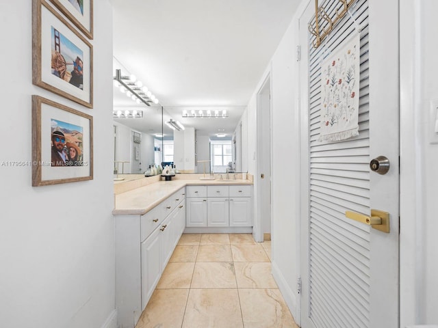 6039 Collins Ave Unit 1015, Miami Beach, FL 33140 - bathroom with baseboards and vanity