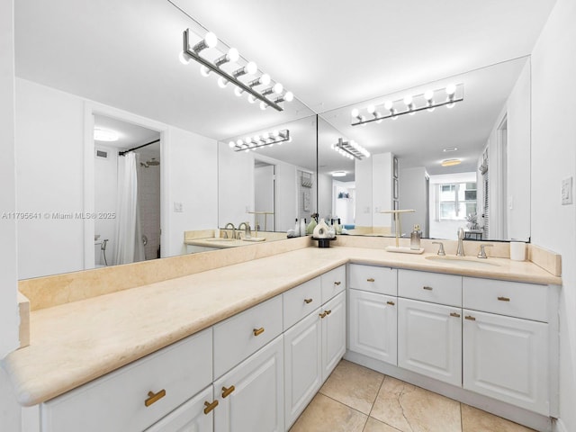 6039 Collins Ave Unit 1015, Miami Beach, FL 33140 - full bath with a shower with shower curtain, double vanity, tile patterned floors, and a sink