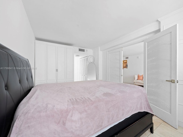 6039 Collins Ave Unit 1015, Miami Beach, FL 33140 - bedroom featuring visible vents and light tile patterned floors