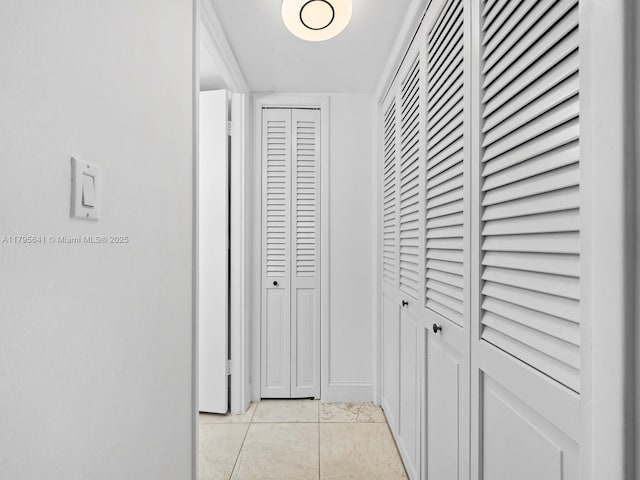6039 Collins Ave Unit 1015, Miami Beach, FL 33140 - corridor with light tile patterned floors