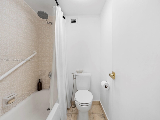 6039 Collins Ave Unit 1015, Miami Beach, FL 33140 - bathroom featuring shower / bath combo, toilet, tile patterned floors, baseboards, and visible vents
