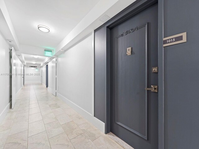 6039 Collins Ave Unit 1015, Miami Beach, FL 33140 - hallway featuring baseboards