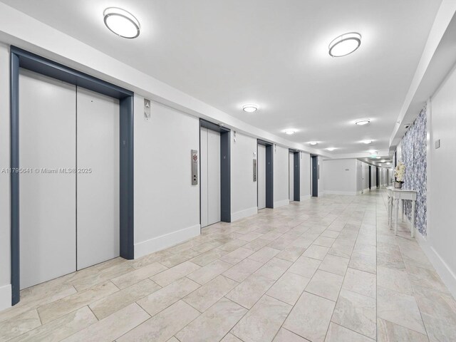 6039 Collins Ave Unit 1015, Miami Beach, FL 33140 - interior space with baseboards and elevator
