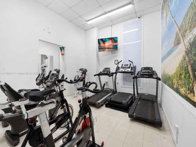 6039 Collins Ave Unit 1015, Miami Beach, FL 33140 - gym featuring a high ceiling and a paneled ceiling