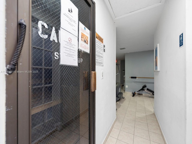 6039 Collins Ave Unit 1015, Miami Beach, FL 33140 - hall featuring baseboards, tile patterned flooring, and visible vents