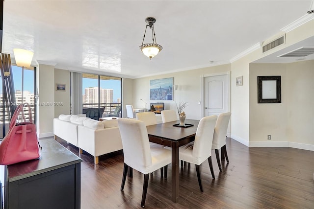 3300 NE 191st St Unit 07, Aventura, FL 33180 - dining area featuring dark wood-type flooring, ornamental molding, and baseboards