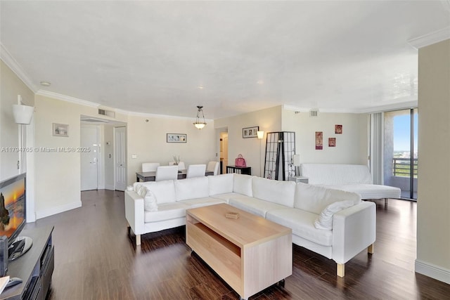 3300 NE 191st St Unit 07, Aventura, FL 33180 - living area with dark wood-type flooring, crown molding, and baseboards