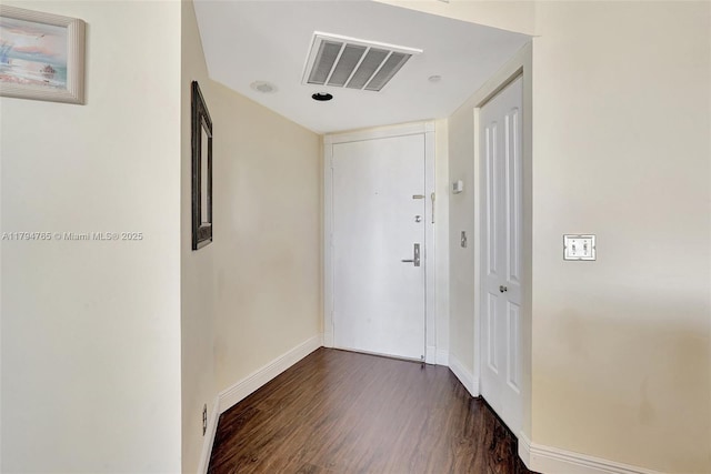 3300 NE 191st St Unit 07, Aventura, FL 33180 - hallway featuring dark wood-type flooring and baseboards