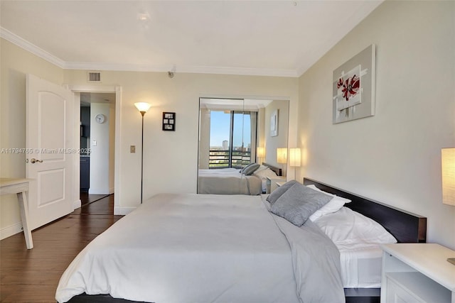 3300 NE 191st St Unit 07, Aventura, FL 33180 - bedroom with dark wood-style floors, ornamental molding, and baseboards