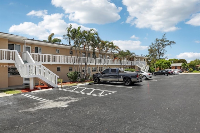 2164 NE 1st Way Unit 103, Boynton Beach, FL 33435 - uncovered parking lot with stairs