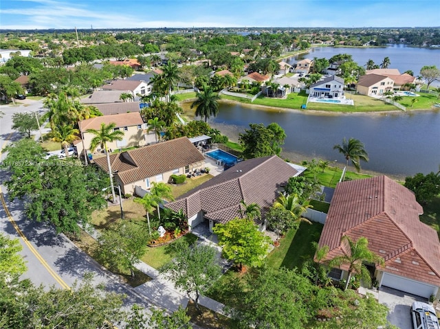 birds eye view of property with a residential view and a water view