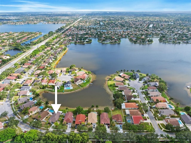 aerial view with a water view and a residential view