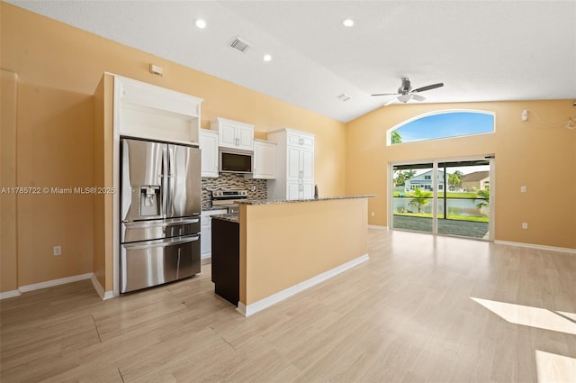 kitchen featuring a ceiling fan, visible vents, appliances with stainless steel finishes, stone countertops, and white cabinets