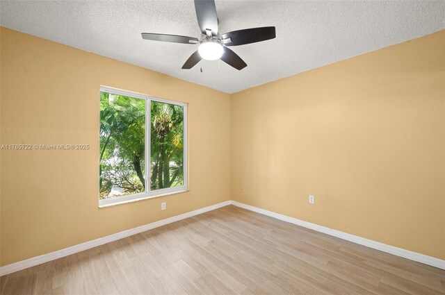 18506 NW 24th Pl, Pembroke Pines, FL 33029 - unfurnished room featuring light wood-type flooring, a textured ceiling, baseboards, and ceiling fan