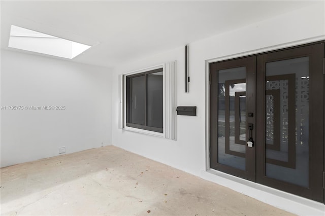 exterior space featuring french doors, stucco siding, and a patio area
