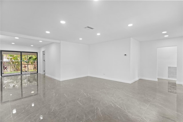 unfurnished room featuring baseboards, marble finish floor, recessed lighting, and visible vents