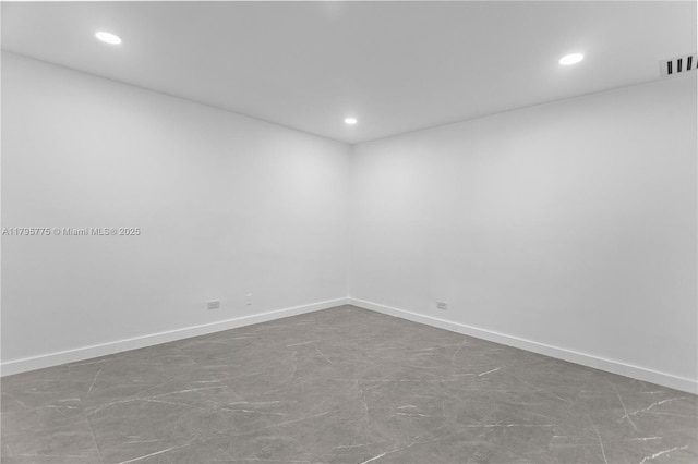 unfurnished room featuring baseboards, recessed lighting, and visible vents