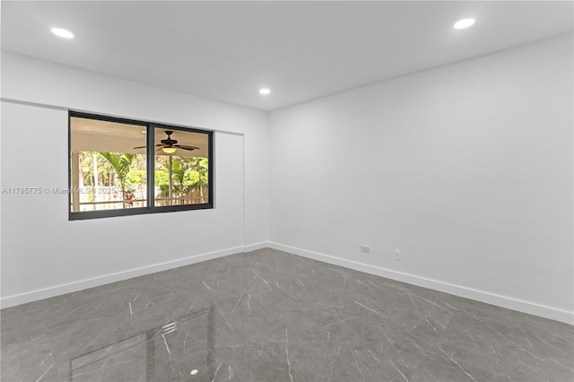 unfurnished room with recessed lighting, baseboards, ceiling fan, and marble finish floor