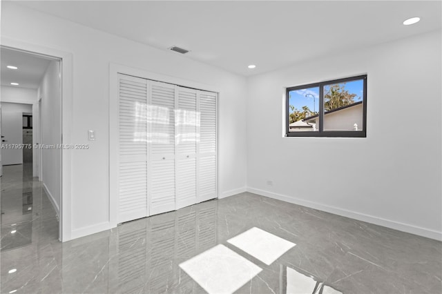 unfurnished bedroom with recessed lighting, baseboards, visible vents, and marble finish floor