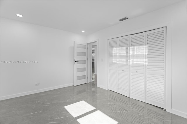 unfurnished bedroom with recessed lighting, visible vents, marble finish floor, and a closet