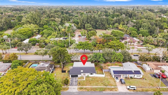 bird's eye view featuring a view of trees and a residential view