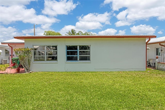 5803 NW 84th Ave, Tamarac, FL 33321 - back of house featuring a lawn and stucco siding