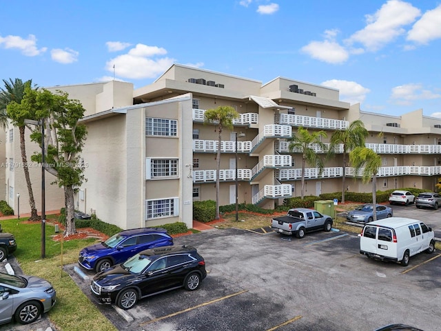 21121 SW 85th Ave Unit 202, Cutler Bay, FL 33189 - view of property featuring uncovered parking