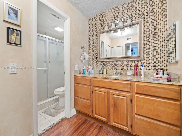 21121 SW 85th Ave Unit 202, Cutler Bay, FL 33189 - full bathroom featuring toilet, visible vents, a shower stall, and vanity