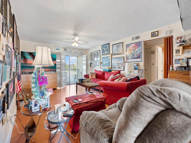 21121 SW 85th Ave Unit 202, Cutler Bay, FL 33189 - living area featuring visible vents, a ceiling fan, and a textured ceiling