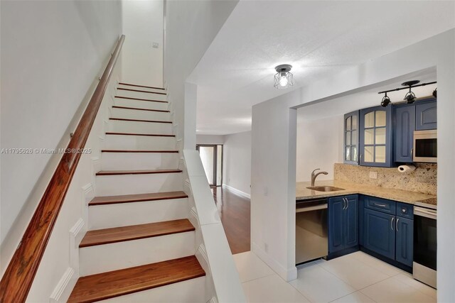 1901 NW S River Dr Unit 14-B, Miami, FL 33125 - stairway with tile patterned flooring