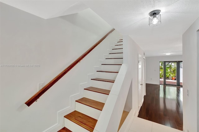 1901 NW S River Dr Unit 14-B, Miami, FL 33125 - staircase with wood finished floors and baseboards