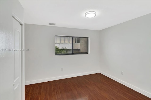 1901 NW S River Dr Unit 14-B, Miami, FL 33125 - empty room with wood finished floors and baseboards