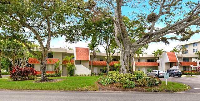 view of property with uncovered parking