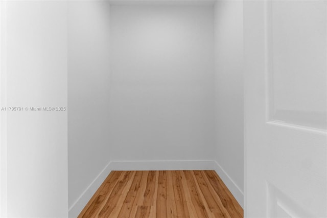 interior space with light wood-style floors and baseboards