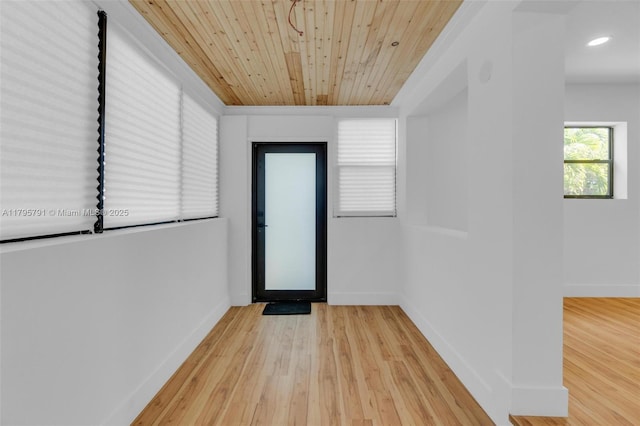 interior space with recessed lighting, baseboards, wood ceiling, and wood finished floors