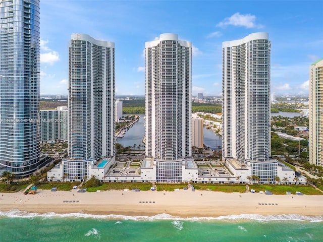 property's view of city with a water view and a view of the beach