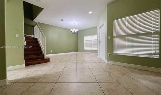 tiled empty room with recessed lighting, baseboards, stairs, and a notable chandelier