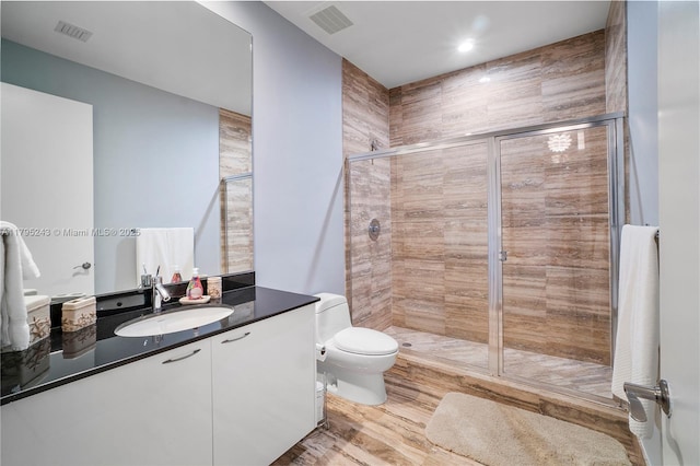 full bath with visible vents, toilet, and a shower stall