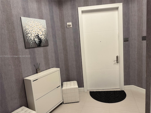 bathroom featuring baseboards and tile patterned floors