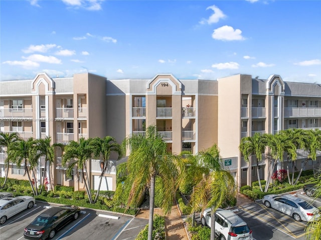 10217 NW 24th Pl Unit 107, Sunrise, FL 33322 - view of apartment building / complex featuring uncovered parking
