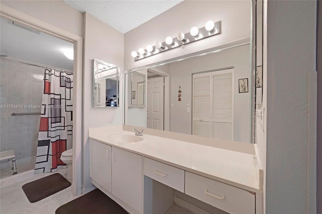 bathroom with toilet, vanity, and curtained shower