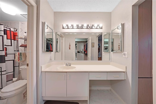 full bath featuring marble look tile flooring, toilet, vanity, and a shower with shower curtain