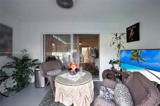 living area featuring finished concrete flooring
